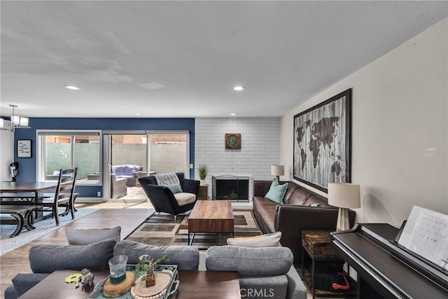 3609 S Parton St, Santa Ana, CA 92707 - living area with a fireplace, wood finished floors, and recessed lighting