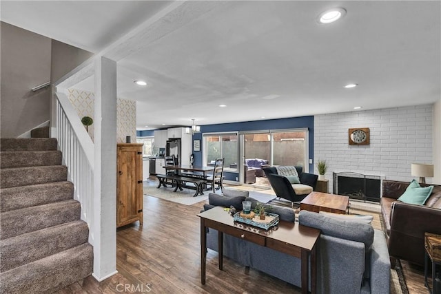 3609 S Parton St, Santa Ana, CA 92707 - living area featuring stairway, wood finished floors, recessed lighting, and a brick fireplace