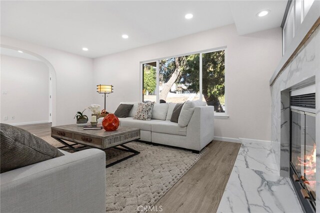 16228 Plummer St, North Hills, CA 91343 - living area featuring arched walkways and recessed lighting