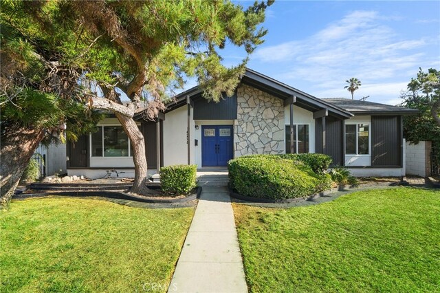 16228 Plummer St, North Hills, CA 91343 - mid-century home with a front lawn and stone siding