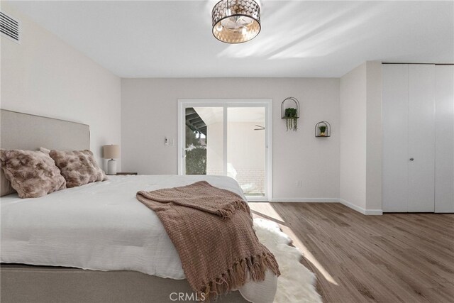 16228 Plummer St, North Hills, CA 91343 - bedroom featuring wood finished floors and a closet