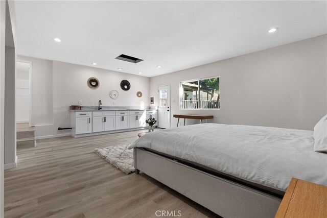 16228 Plummer St, North Hills, CA 91343 - bedroom with light wood finished floors and recessed lighting