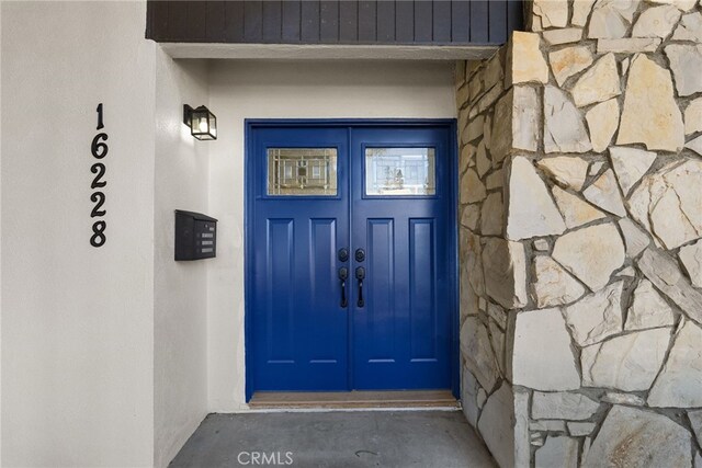 16228 Plummer St, North Hills, CA 91343 - entrance to property with stone siding and french doors