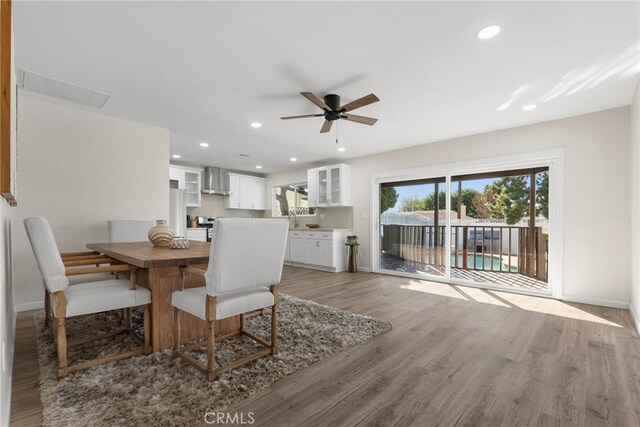 16228 Plummer St, North Hills, CA 91343 - dining area with a ceiling fan, light wood-type flooring, and recessed lighting