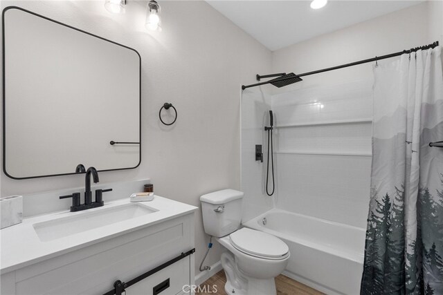 16228 Plummer St, North Hills, CA 91343 - bathroom with shower / bath combo with shower curtain, vanity, and wood finished floors