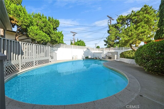 16228 Plummer St, North Hills, CA 91343 - view of pool with a fenced backyard