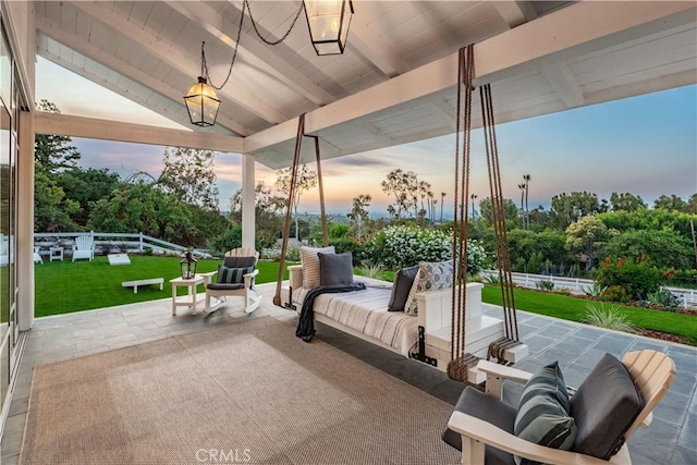 16 Roadrunner Rd, Rolling Hills, CA 90274 - patio terrace at dusk with a patio area, an outdoor living space, and a lawn