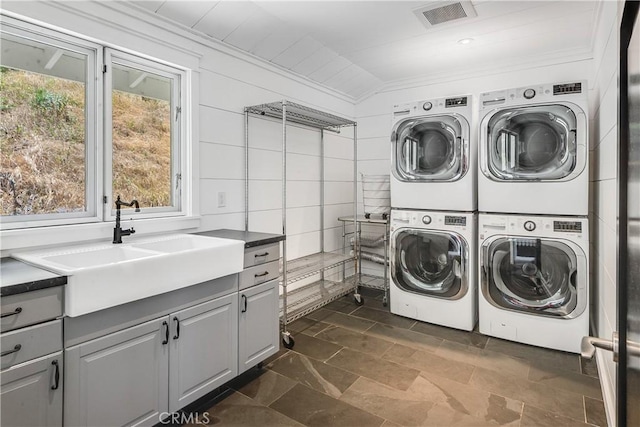 16 Roadrunner Rd, Rolling Hills, CA 90274 - washroom with stacked washer / drying machine, cabinet space, plenty of natural light, washing machine and clothes dryer, and crown molding