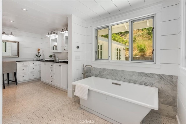16 Roadrunner Rd, Rolling Hills, CA 90274 - full bath with a freestanding bath, double vanity, ornamental molding, and recessed lighting