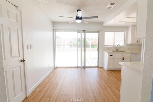 1714 Evelyn Pl, Palmdale, CA 93550 - unfurnished dining area featuring a ceiling fan, a textured ceiling, and light wood finished floors