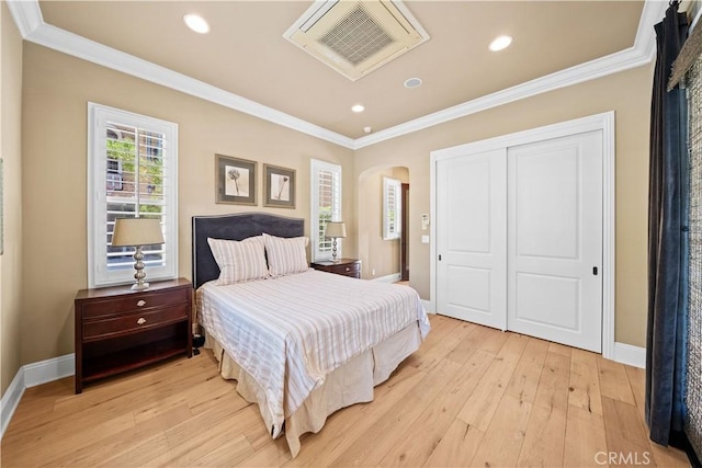 19668 Three Oaks Ln, Walnut, CA 91789 - bedroom featuring ornamental molding, light wood-type flooring, a closet, arched walkways, and recessed lighting