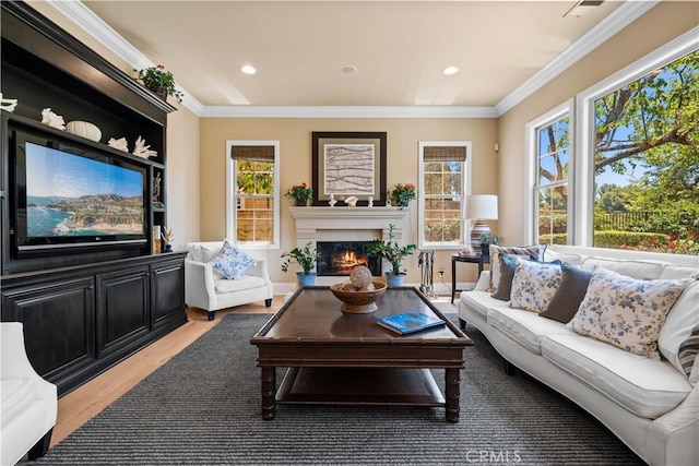 19668 Three Oaks Ln, Walnut, CA 91789 - living room featuring light wood-style flooring, plenty of natural light, a warm lit fireplace, crown molding, and recessed lighting