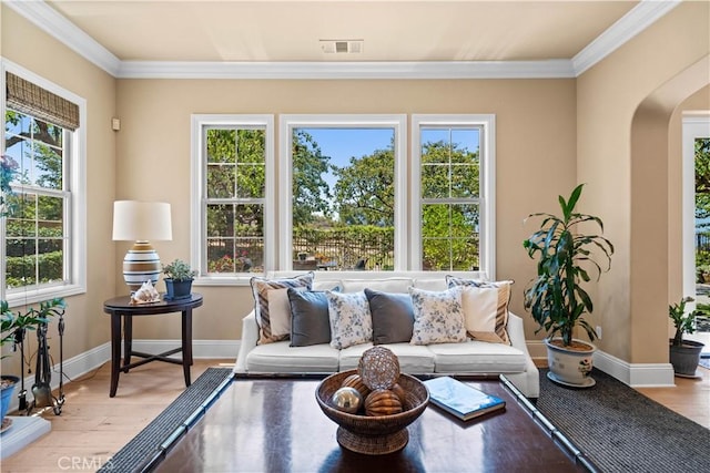 19668 Three Oaks Ln, Walnut, CA 91789 - living room featuring arched walkways, wood finished floors, plenty of natural light, and crown molding