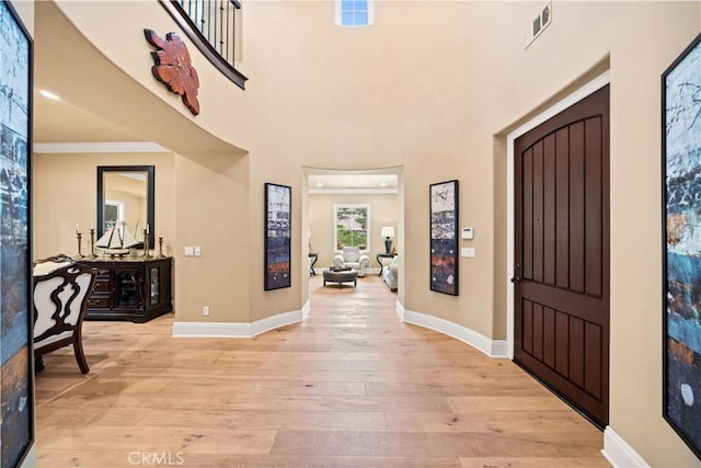 19668 Three Oaks Ln, Walnut, CA 91789 - entryway featuring light wood-style floors and crown molding