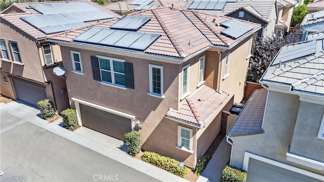 16004 Huckleberry Ave, Chino, CA 91708 - view of home's exterior featuring stucco siding, an attached garage, and a tiled roof