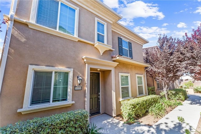 16004 Huckleberry Ave, Chino, CA 91708 - doorway to property featuring stucco siding