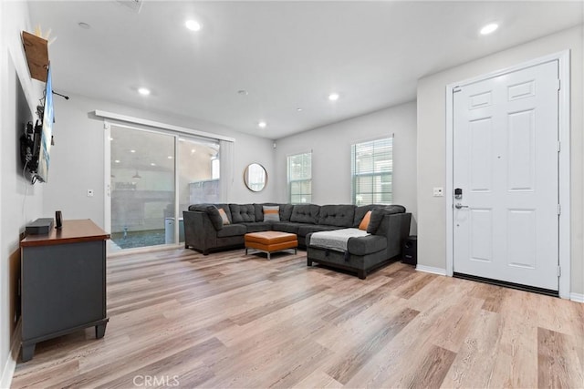16004 Huckleberry Ave, Chino, CA 91708 - living room featuring light wood-style floors and recessed lighting