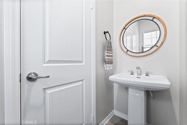 16004 Huckleberry Ave, Chino, CA 91708 - bathroom featuring baseboards and wood finished floors