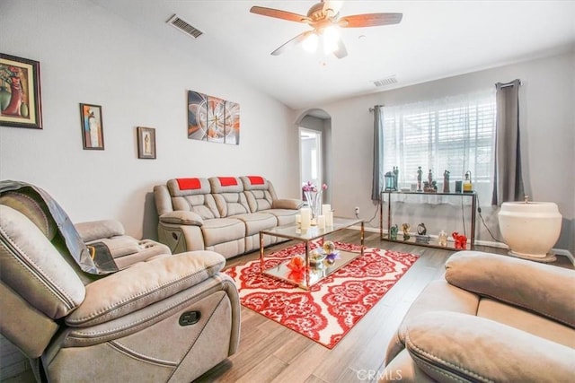 17993 Mondamon Rd, Apple Valley, CA 92307 - living room featuring wood finished floors, a ceiling fan, arched walkways, and lofted ceiling