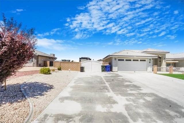 17993 Mondamon Rd, Apple Valley, CA 92307 - view of yard with a gate, concrete driveway, and a garage