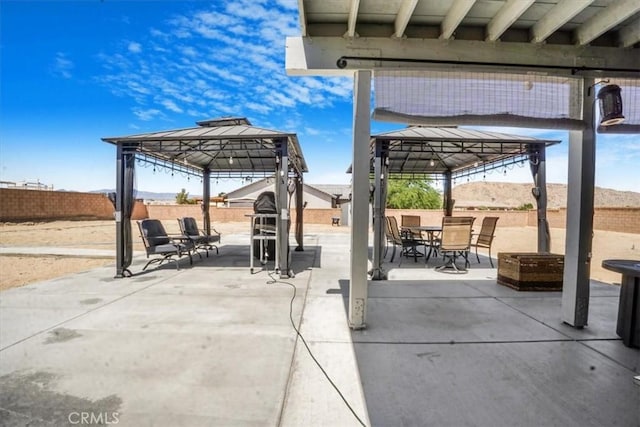 17993 Mondamon Rd, Apple Valley, CA 92307 - fenced backyard featuring a gazebo, a patio, and outdoor dining space