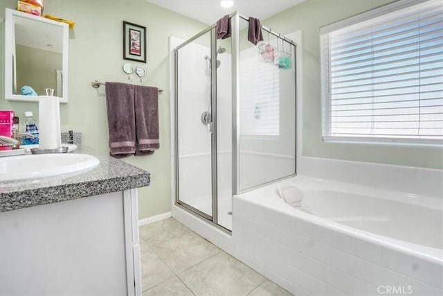 17993 Mondamon Rd, Apple Valley, CA 92307 - bathroom with a garden tub, a shower stall, tile patterned flooring, and vanity