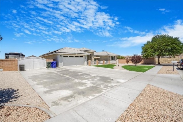 17993 Mondamon Rd, Apple Valley, CA 92307 - view of front of property featuring a gate, concrete driveway, and an attached garage