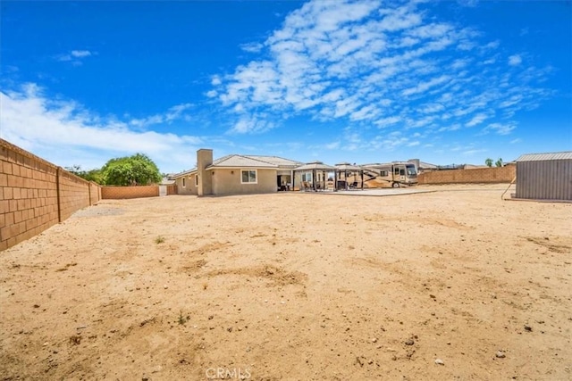 17993 Mondamon Rd, Apple Valley, CA 92307 - back of property with a fenced backyard