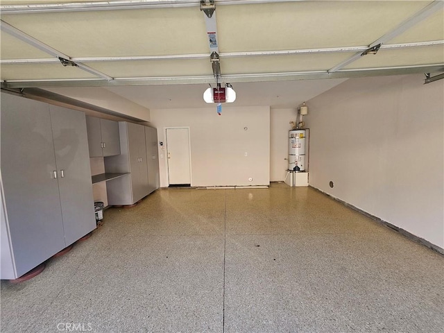 11 Emory Unit 85, Irvine, CA 92602 - garage featuring secured water heater and a garage door opener