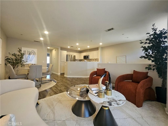 11 Emory Unit 85, Irvine, CA 92602 - living area with wood finished floors and recessed lighting