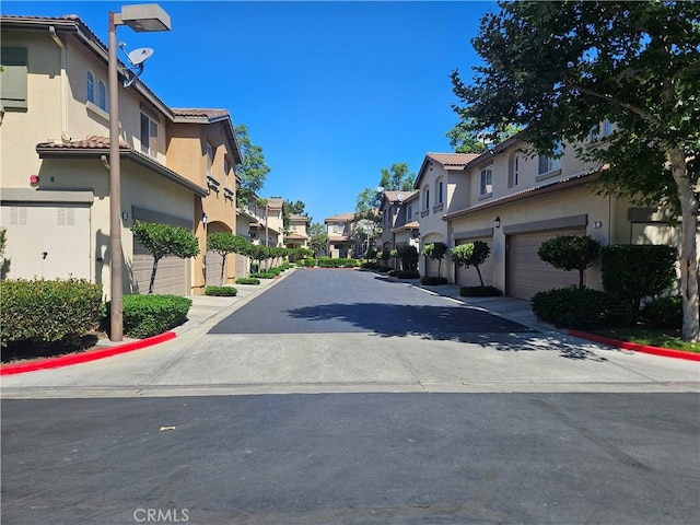 11 Emory Unit 85, Irvine, CA 92602 - view of asphalt street featuring a residential view and curbs