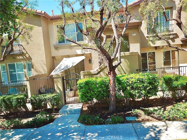 11 Emory Unit 85, Irvine, CA 92602 - view of building exterior featuring a fenced front yard
