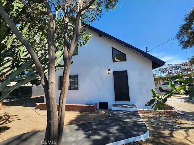 700 E Compton Blvd, Rancho Dominguez, CA 90220 - back of property with stucco siding and a patio area