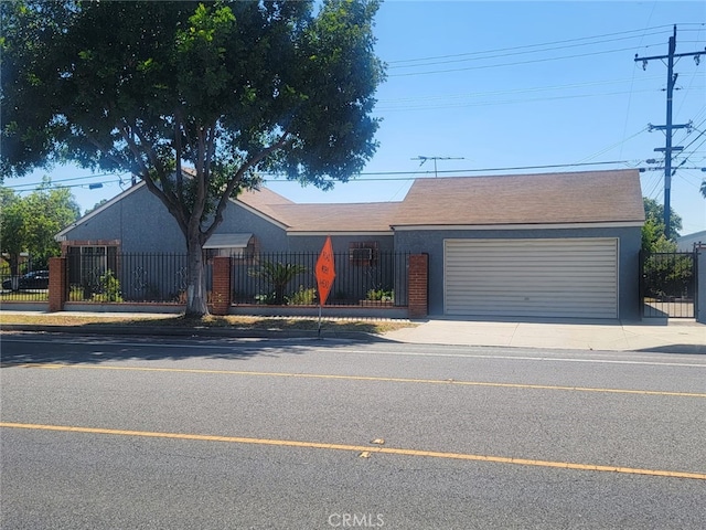 8502 Borson St, Downey, CA 90242 - ranch-style home with a garage, a fenced front yard, driveway, and brick siding