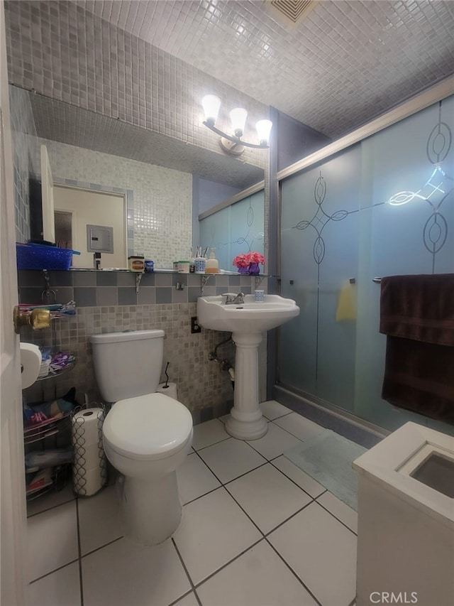 8502 Borson St, Downey, CA 90242 - full bathroom with a stall shower, tile walls, and tile patterned floors