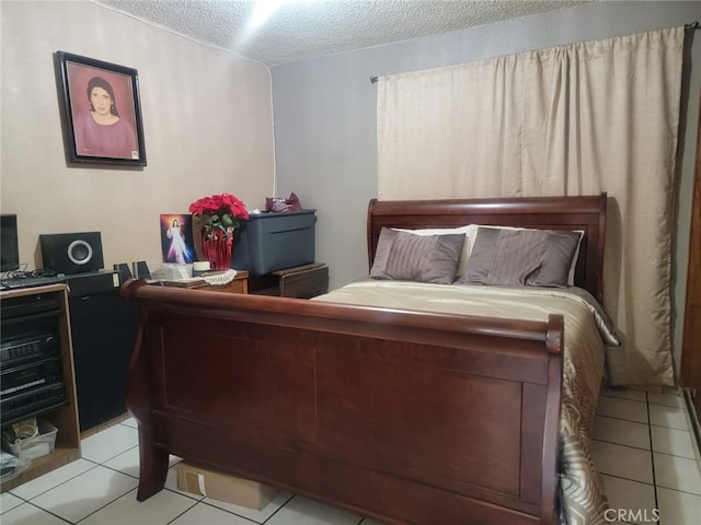 8502 Borson St, Downey, CA 90242 - bedroom with a textured ceiling and light tile patterned floors