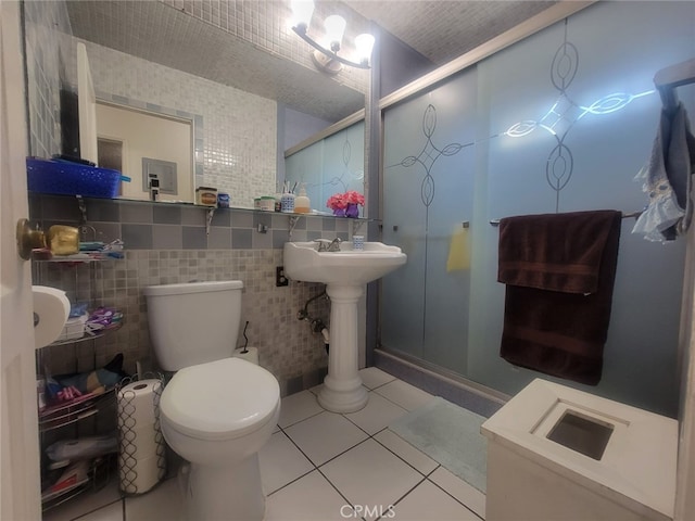8502 Borson St, Downey, CA 90242 - full bathroom with a stall shower, tile patterned flooring, and tile walls
