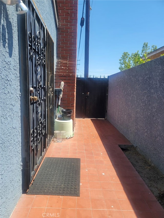8502 Borson St, Downey, CA 90242 - property entrance featuring stucco siding and brick siding