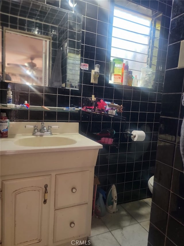 8502 Borson St, Downey, CA 90242 - bathroom with tile walls, vanity, and tile patterned flooring