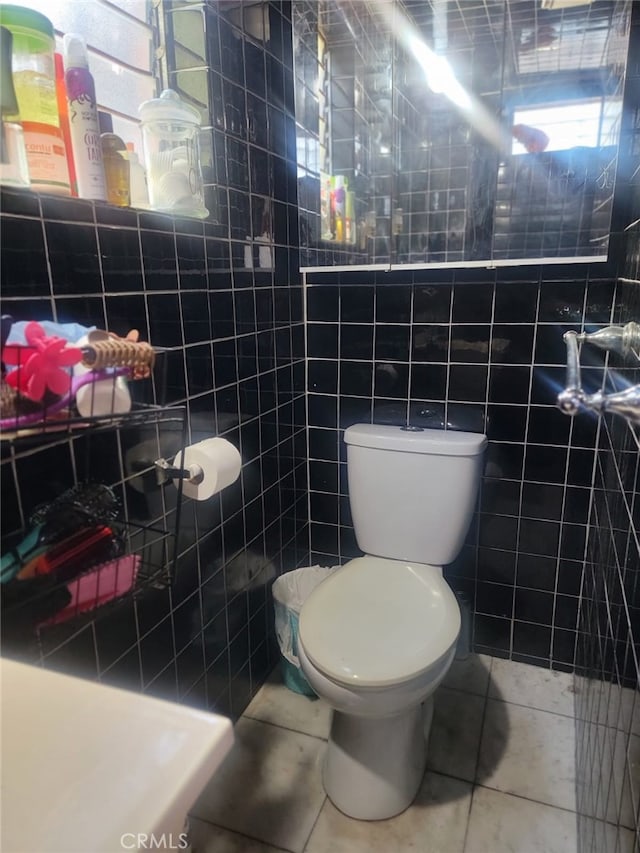 8502 Borson St, Downey, CA 90242 - bathroom with tile patterned flooring and tile walls