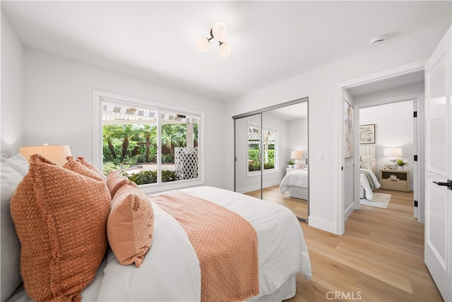 12 Creekside, Irvine, CA 92603 - bedroom featuring light wood-style floors and a closet
