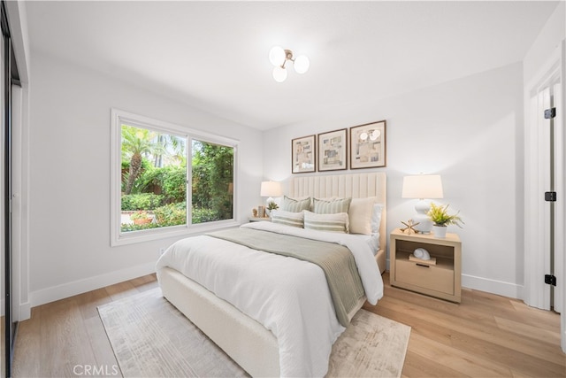 12 Creekside, Irvine, CA 92603 - bedroom featuring light wood-type flooring and baseboards