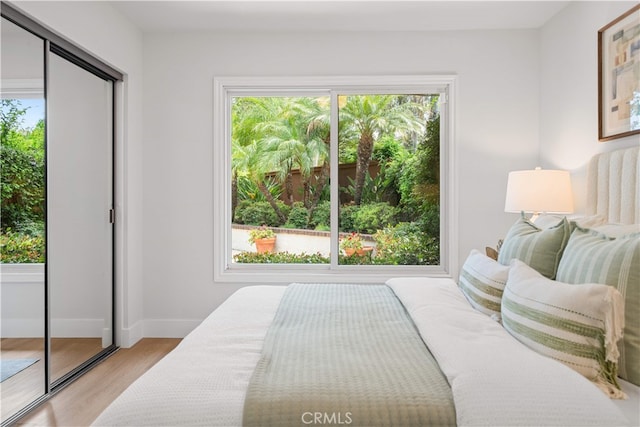 12 Creekside, Irvine, CA 92603 - bedroom featuring light wood-type flooring and baseboards