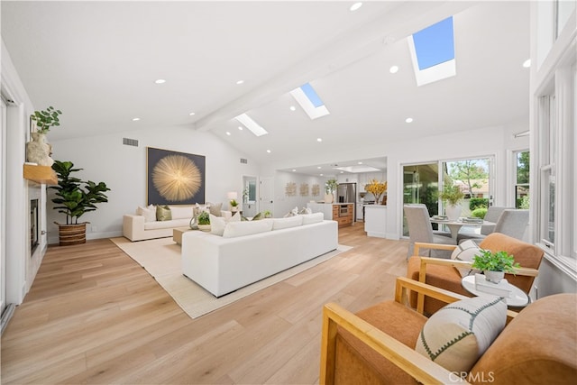 12 Creekside, Irvine, CA 92603 - living area with a skylight, high vaulted ceiling, light wood-style floors, recessed lighting, and beam ceiling