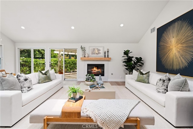 12 Creekside, Irvine, CA 92603 - living area featuring lofted ceiling, a glass covered fireplace, recessed lighting, and light wood-style floors