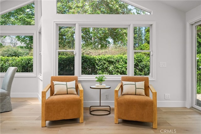 12 Creekside, Irvine, CA 92603 - living area with vaulted ceiling, wood finished floors, and healthy amount of natural light