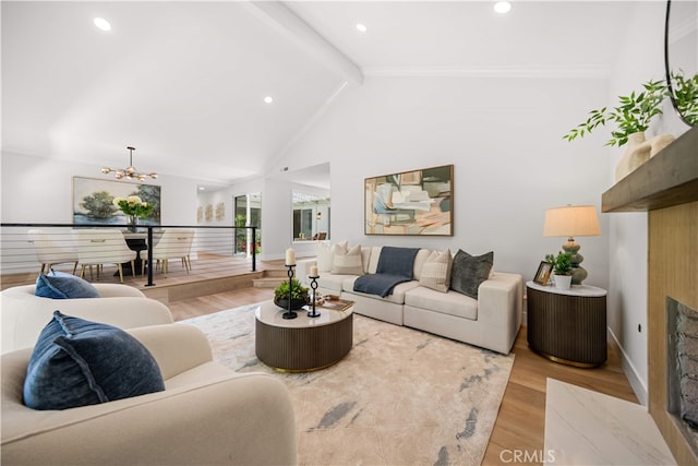 12 Creekside, Irvine, CA 92603 - living room with wood finished floors, a fireplace, a chandelier, recessed lighting, and ornamental molding