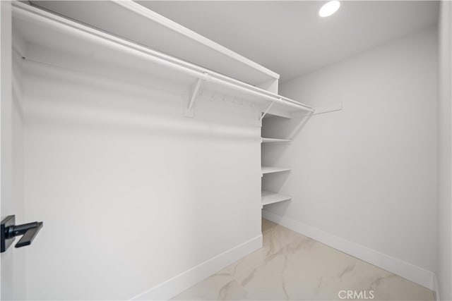 12 Creekside, Irvine, CA 92603 - spacious closet featuring marble look tile flooring