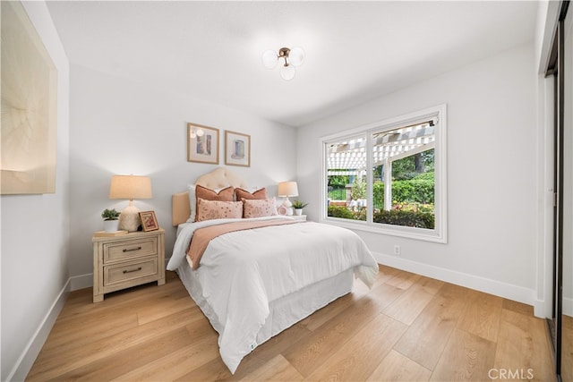 12 Creekside, Irvine, CA 92603 - bedroom featuring baseboards and light wood finished floors