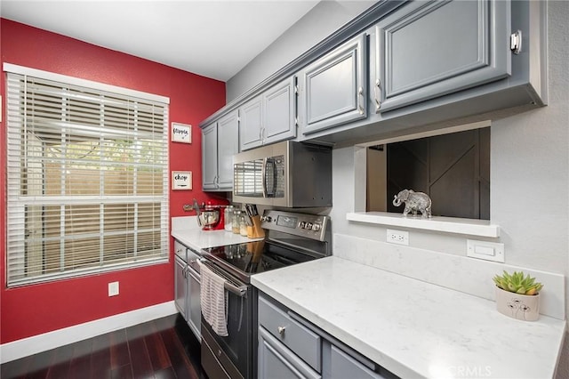 375 Central Ave Unit 196, Riverside, CA 92507 - kitchen featuring appliances with stainless steel finishes, gray cabinets, dark wood-type flooring, and light countertops